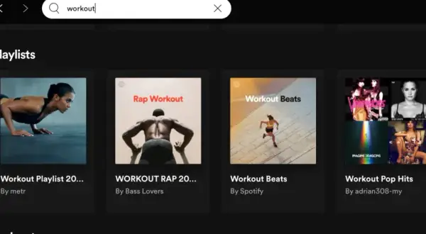 Spotify search results for "workout" show various workout playlist covers, including "Workout Playlist 20...", "WORKOUT RAP 20...", "Workout Beats", "Workout Pop Hits", and "Workout Rock Playlist".