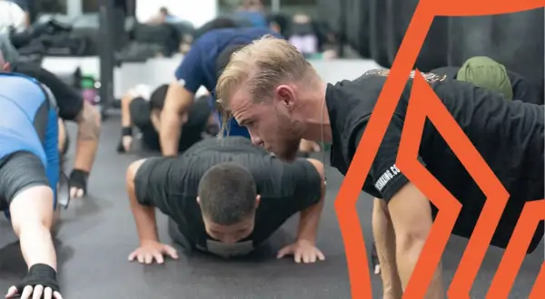 Boxers perform push-ups as part of their intense boxing stretches routine, building strength and endurance for the ring.
