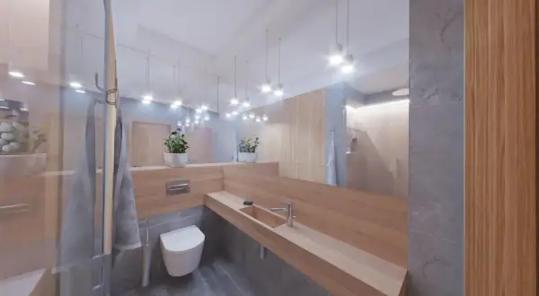 Nowoczesne gotowe projekty łazienek: drewniany blat, szara kamienna podłoga, wisząca toaleta i lustro na całą ścianę.