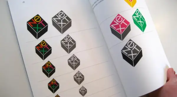 A book page displays variations of the iconic "NeXT" logo, showcasing Paul Rand's famous works and exploring different color combinations.