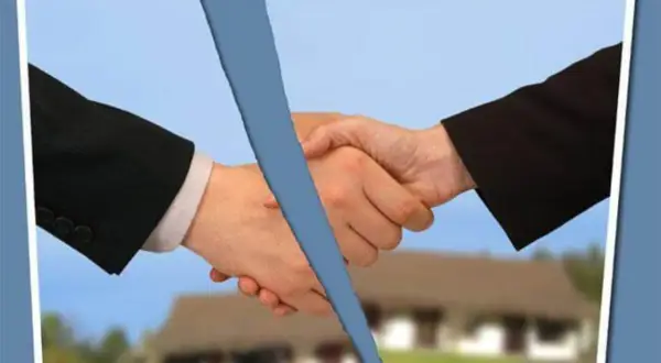 Mani che si stringono, ma una linea blu le divide. La psicologia del voltare le spalle a un accordo.