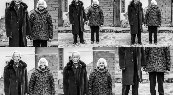 A loving elderly couple, their faces etched with time, stand hand-in-hand. This heartwarming scene offers great photo essay ideas about enduring love and life's journey.