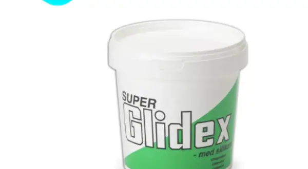 Białe wiaderko z zielonym pasem i napisem "SUPER Glidex - med silikon". Idealne do gładkiego poślizgu.