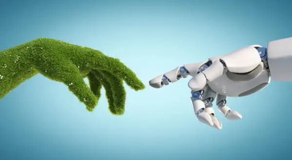 Mano verde e mano robotica si sfiorano, simboleggiando il futuro dell'ingegneria ambientale e i suoi sbocchi lavorativi.