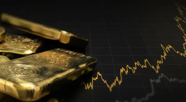 Goldbarren liegen auf einem Diagramm, das den Aufwärtstrend des Goldpreises zeigt. Ein visueller Leitfaden, wie investiere ich in gold.