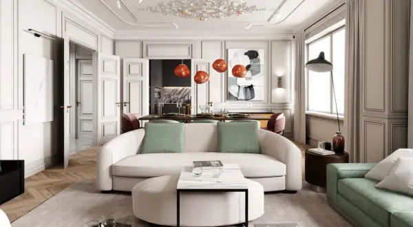 Eleganckie wnętrza modern classic z sofą w kształcie litery C, zielonymi akcentami i designerskimi lampami.