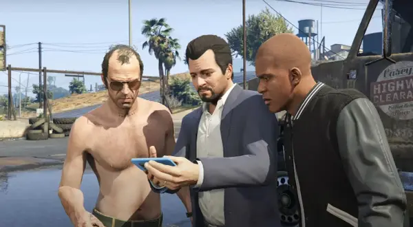 Trzej główni gta 5 postacie: Trevor, Michael i Franklin, patrzą na telefon.