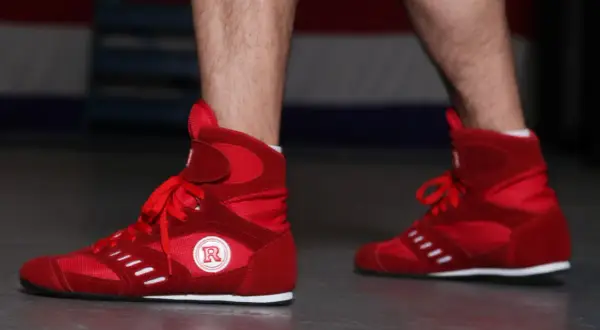Red boxing shoes ready for intense boxing footwork drills.