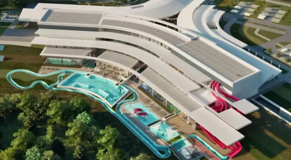 Nowoczesny aquapark Rzeszów z basenami, zjeżdżalniami i strefą relaksu, otoczony zielenią.