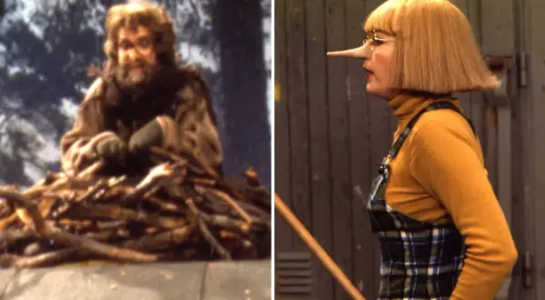 En man med skägg och glasögon sitter på en hög med ved. Bredvid honom en kvinna med näsa som Pinocchio, kanske är det ugglan Helge som har en hemlighet.