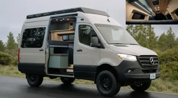Beżowy Mercedes Sprinter 4x4 z otwartymi drzwiami, ukazujący przytulne wnętrze kampera. Idealny na przygody w terenie.