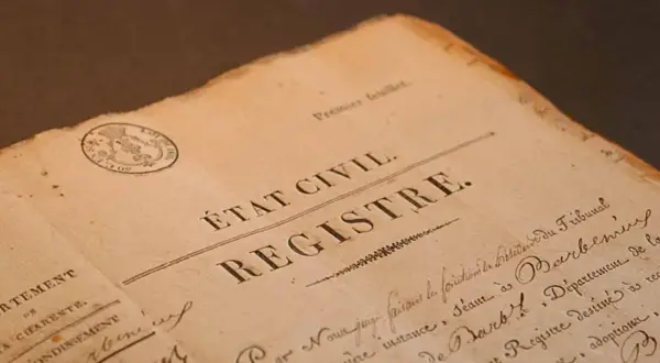 Extrait d'un registre d'état civil 36, datant d'une époque révolue, avec un cachet officiel et une écriture manuscrite.