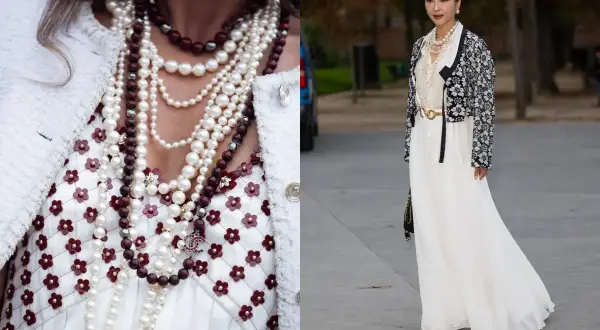 Elegancka kobieta w styl retro ubrania, z wieloma naszyjnikami z pereł i kamieni, w białej sukni i ozdobnej marynarce.