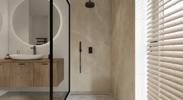 Modernes Bad mit Holzboden und Marmor-Dusche. Ein Waschbecken mit Spiegel und eine Dusche sind sichtbar. Ideal für ein **bad renovieren ohne fliesen abschlagen**.