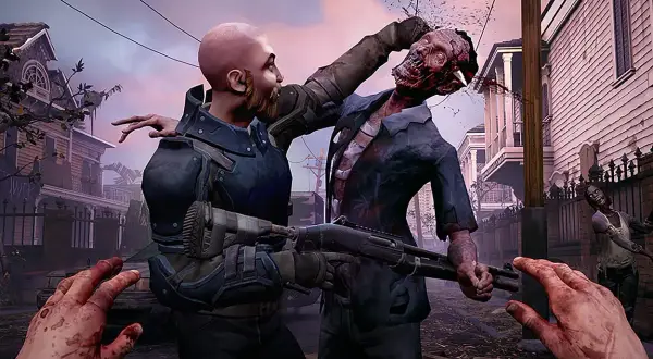 Intensywna walka w grach o zombie. Gracz walczy z potworem, który ma rozszarpaną głowę. W tle widać inne zombie i zniszczone domy.