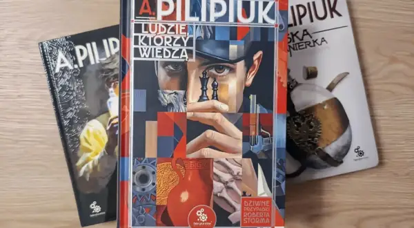 Kolekcja książek A. Pilipiuka: "Ludzie, którzy wiedzą" i "Dziwne przypadki Roberta Storma" oraz inna, nieczytelna okładka.