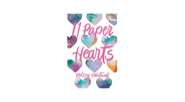 11 papierowych serc w akwarelowych barwach, tworzących tytuł "11 Paper Hearts" i nazwisko Kelsey Hartwell.