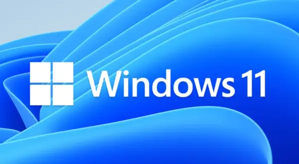 Logo Windows 11 na tle falujących niebieskich kształtów. To najnowszy Windows, który oferuje nowoczesny interfejs i nowe funkcje.