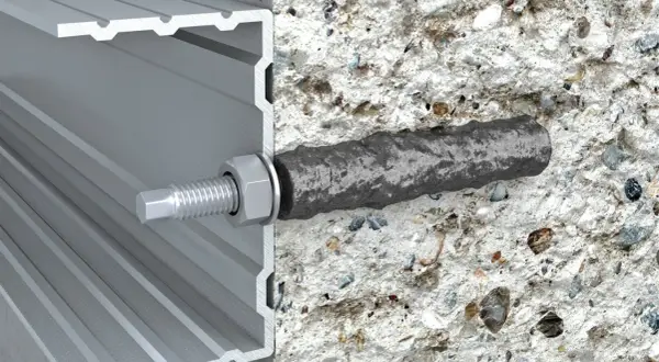 Przekrój kotwy chemicznej w betonie i profilu aluminiowym.