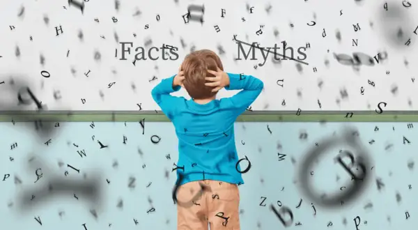 Jongen met handen in het haar, omringd door zwevende letters. Boven hem staat 'Facts' en 'Myths', wat de uitdaging van wat is begrijpend lezen illustreert.