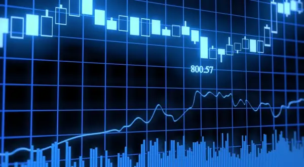 Wykresy finansowe pokazują zmienność rynkową, sugerując potencjalną fuzję banków i jej wpływ na kursy.