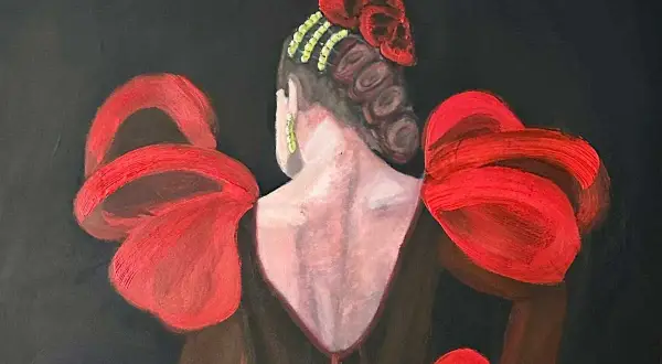 Una flamenca con un vestido rojo vibrante y un peinado elaborado, lista para bailar.