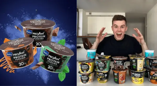 Mężczyzna z otwartymi ustami i rękami w górze, otoczony przez wiele kubków puddingu proteinowego.