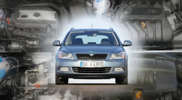 Szara Skoda Octavia 2 na tle silników.