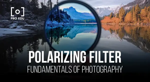 A polarizing filter enhances a landscape photo, reducing glare and deepening colors. The image shows a lake reflecting mountains and trees, with the filter in the foreground.