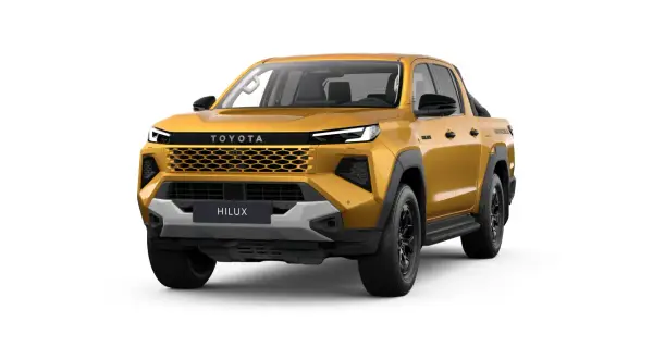 Złoty Toyota Hilux z czarnymi dodatkami i nowoczesnym grillem, gotowy na każdą przygodę.