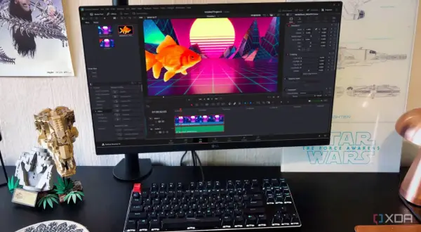 A computer monitor displays DaVinci Resolve, showing a goldfish in a retro neon landscape. This setup hints at a comparison between davinci resolve vs after effects for video editing.