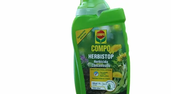 Bouteille verte de désherbant Compo Herbistop, à base d'acide pélargonique, pour un jardin sans mauvaises herbes.