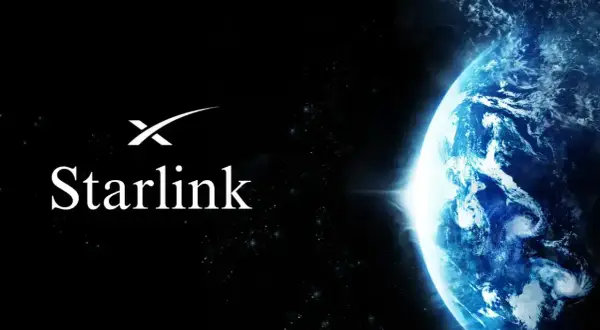 Logo Starlink na tle Ziemi z kosmosu. To jest co to jest Starlink – satelitarny internet.