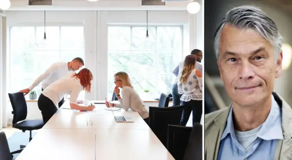 Mötesrum med folk som diskuterar, en del verkar fastna i funktionell dumhet. Till höger en man med grått hår.