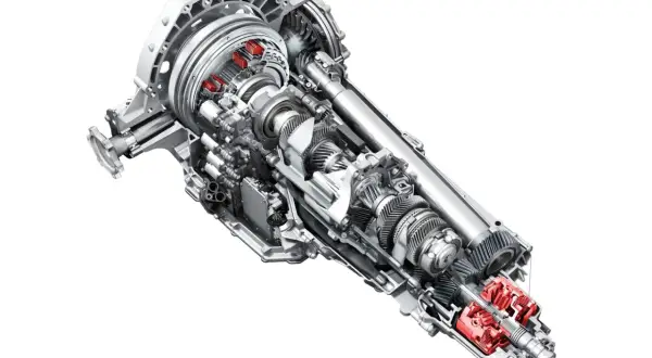 Przekładnia s tronic z widocznymi elementami hydraulicznymi i mechanicznymi.