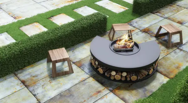 Modern patio with fire pit and stools on rustic tiles, perfect for **suelos para jardín sin obra**.