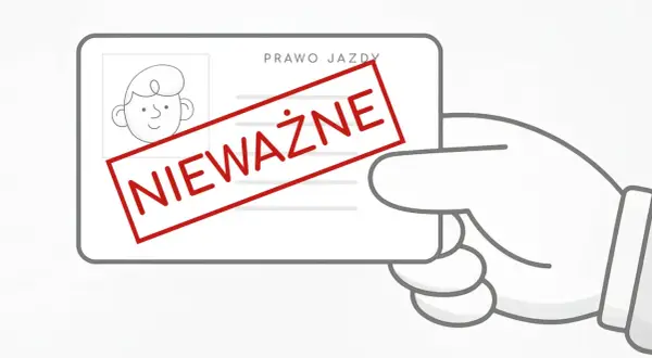 Ręka trzyma nieważne prawo jazdy. Taka sytuacja może skutkować grzywną, a nawet mandatem.