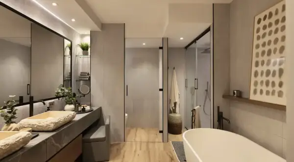 Elegante baño moderno con lavabos de piedra natural, bañera exenta y ducha acristalada. La decoración baños combina texturas y tonos neutros.