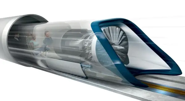 Kapsuła hyperloop z pasażerami w środku, napędzana turbiną, pędzi przez tunel.