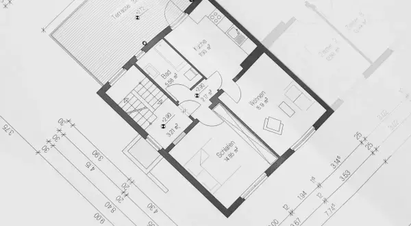 Grundriss einer Wohnung (ca. 100 qm) mit Küche, Bad, Wohn- und Schlafzimmer. Ideal für 2 Personen, die Nebenkosten im Blick behalten.