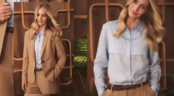Elegancka kobieta w beżowym garniturze i błękitnej koszuli. Idealny dress code biznesowy damski.