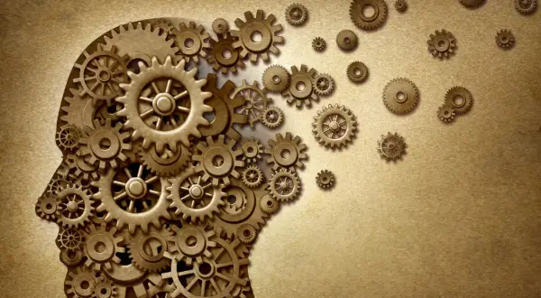 Profilo umano composto da ingranaggi, simbolo di un approccio breve strategico e del funzionamento della mente.