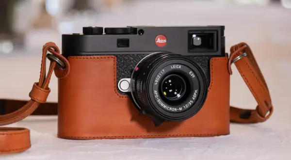 A Leica M camera in a brown leather case, with a Leica APO-Summicron-M 1:2/35 ASPH. lens. Are Leica cameras good? This one certainly looks the part.