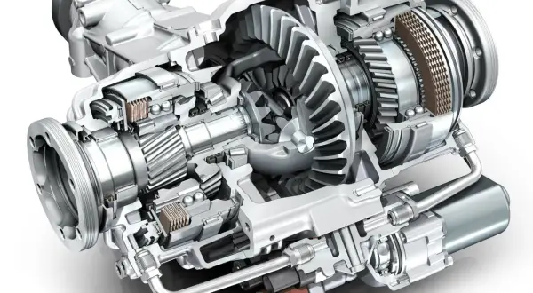 Przekrój mechanizmu dyferencjału z widocznymi zębatkami, łożyskami i elementami sterującymi.