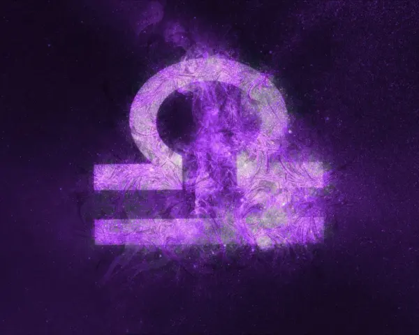 Symbol wagi zodiak w fioletowej mgławicy.