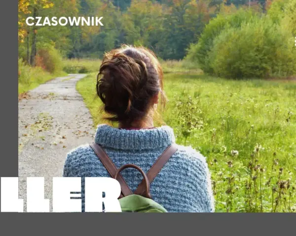 Osoby po francusku, spacerujące jesienną alejką wśród kolorowych drzew.
