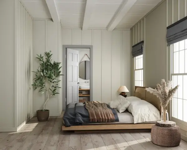 Camera da letto con letto in legno, la sua posizione rispetto alla porta aperta che rivela un bagno.