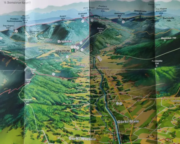 Mapa turystyczna z zaznaczonymi szlakami z Brennej. Widok na góry, lasy i doliny z wioskami.