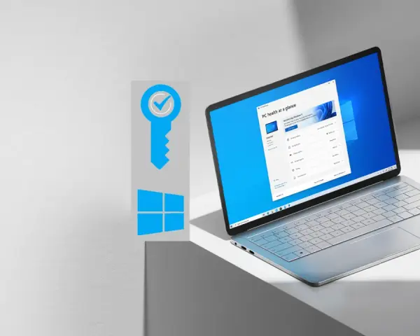 Grafika klucza z symbolem Windows i otwarty laptop z systemem Windows 11.