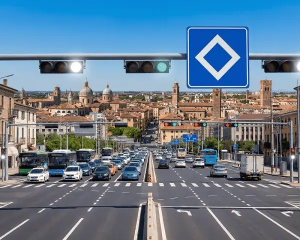 Traffico intenso in città con semaforo verde che indica via libera. Edifici storici sullo sfondo.